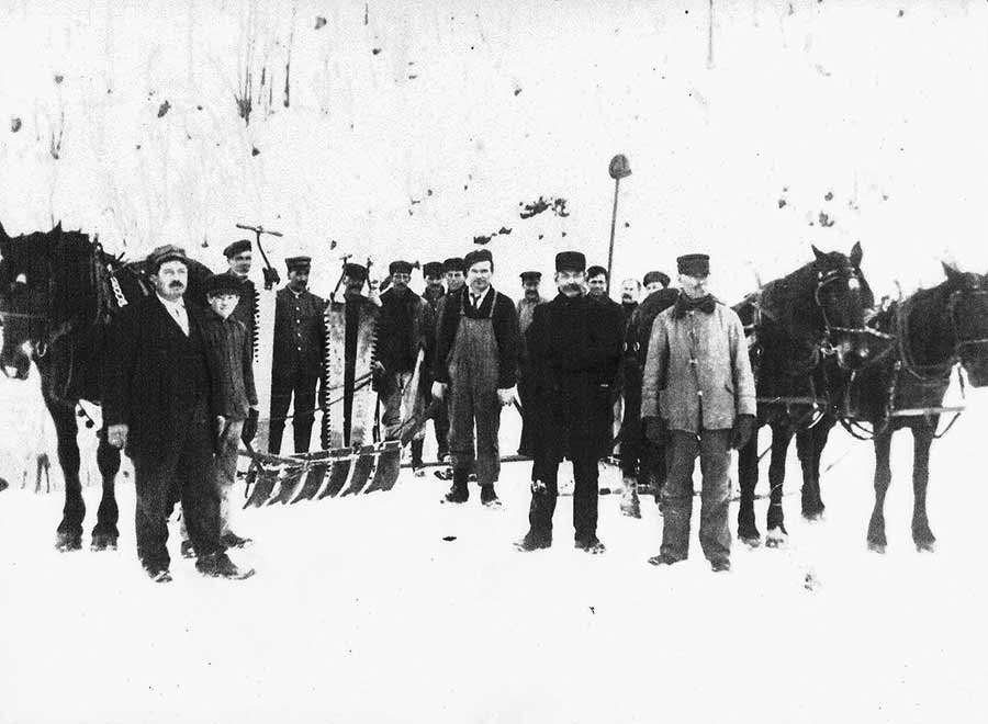 JP Gengler and the crew with the equipment they used to harvest ice from the man-made ice pond.